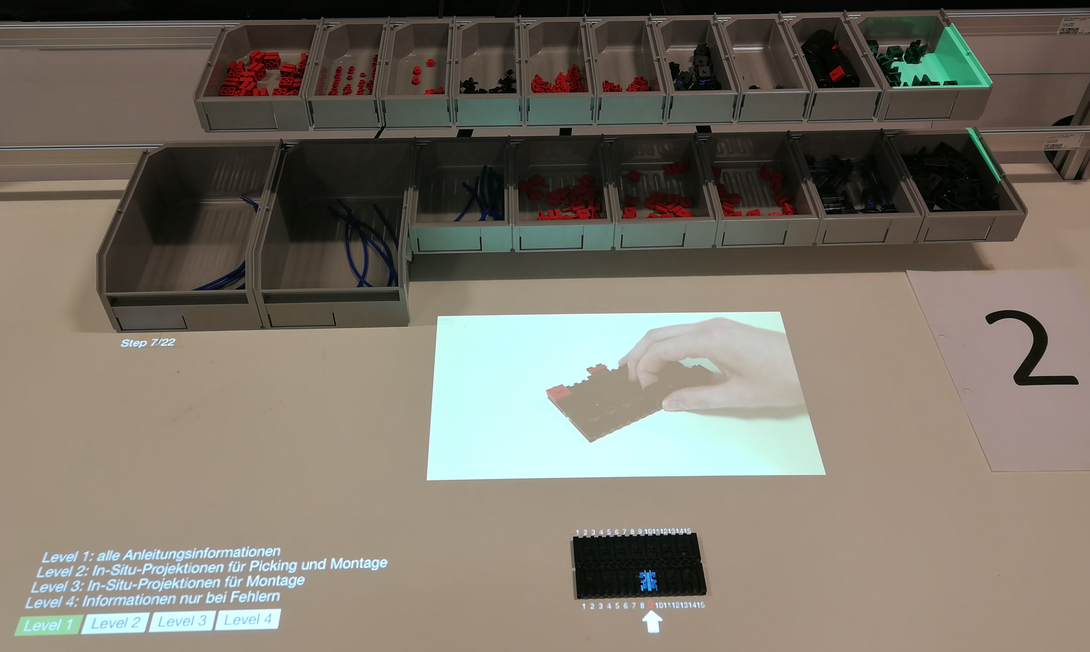 Augmented Reality Training for Industrial Assembly Work – Are Projection-based AR Assistive Systems an Appropriate Tool for Assembly Training?