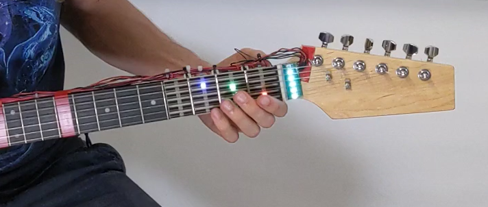 Let’s Frets! Assisting Guitar Students during Practice via Capacitive Sensing